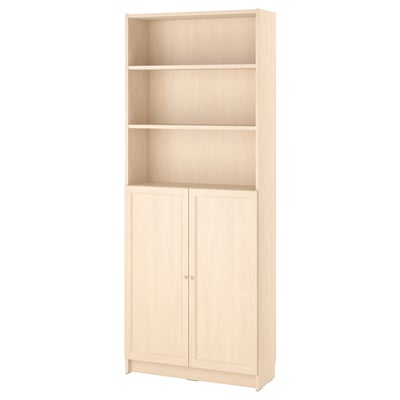 White BILLY bookcase with adjustable shelves and closed storage.