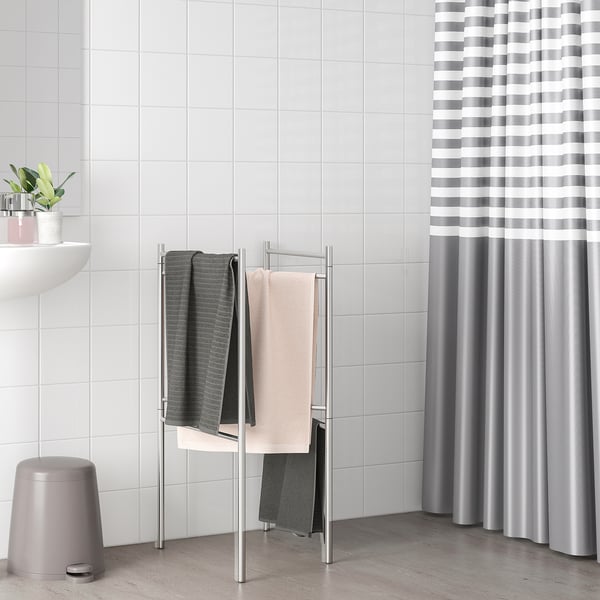 Silver BROGRUND towel stand with dark & light towels, folds flat for storage.