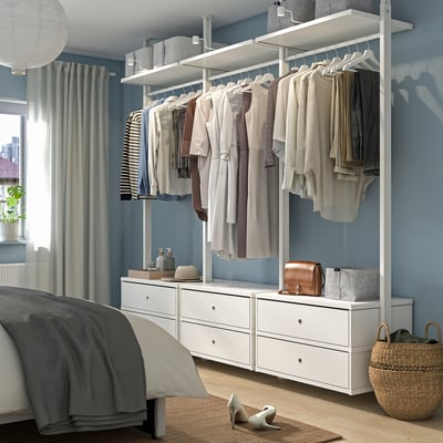 ELVARLI wardrobe in white, organised with clothes, blue room with large window