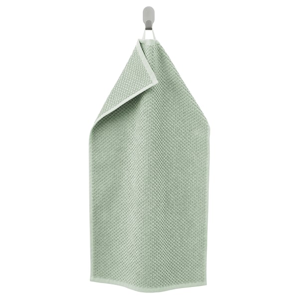 A beige GULVIAL towel hanging, made of soft cotton, rectangular with a textured design.