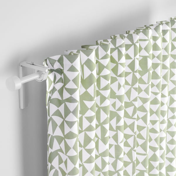 Green-white patterned curtains with pleats, offering privacy and light.