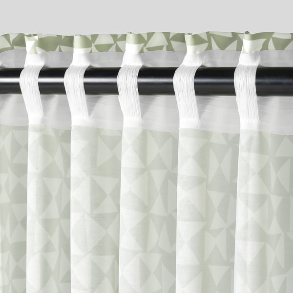Green patterned white curtains on black rod, sheer and private.