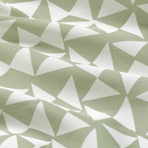 Geometric curtains, green-white triangles, soft fabric, partially sheer.