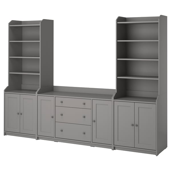 A grey HAUGA storage set including two tall bookcases and a wide sideboard with drawers and cabinets.