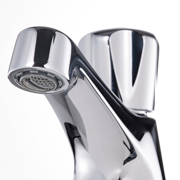 Close-up of a sleek, chrome-plated tap with an aerator, emphasising modern design and durability.
