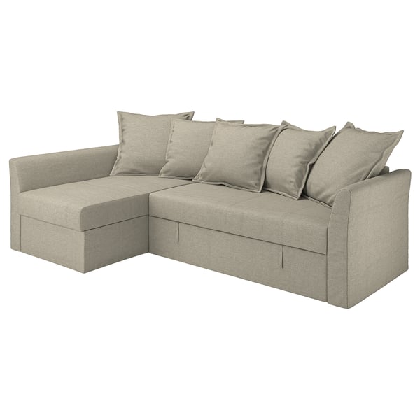 HOLMSUND beige corner sofa bed, clean-lined, with six cushions.