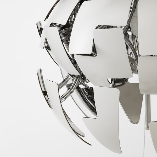 Modern, geometric pendant lamp with reflective, metallic surfaces and strings, emitting a futuristic glow.