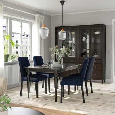 INGATORP extendable dining table with 6 blue chairs, chandeliers & cabinet. Window with city view.