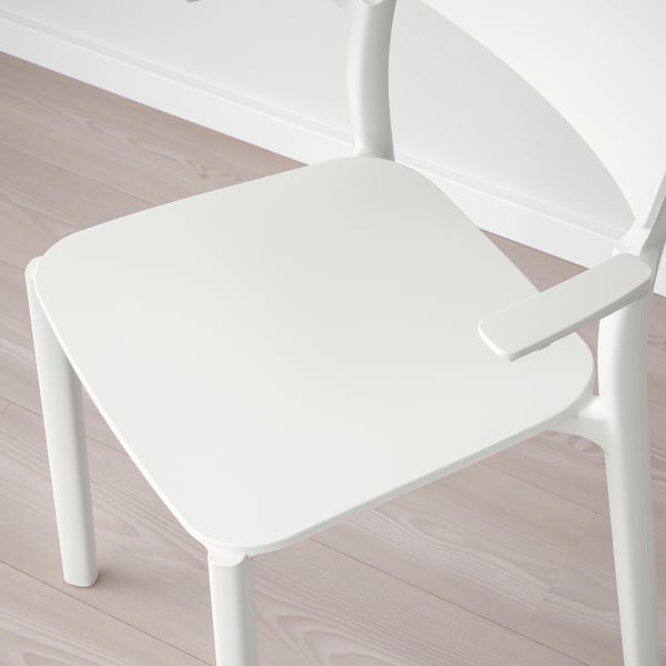 Top view of a modern white plastic chair on a wooden floor, showcasing its clean lines and sturdy design.