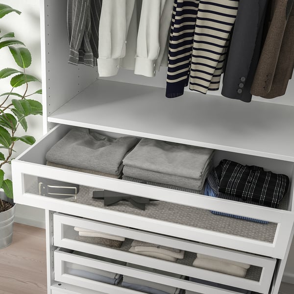 White wardrobe drawer with glass front, organising folded clothes and ties. It closes softly and fits pax frames.
