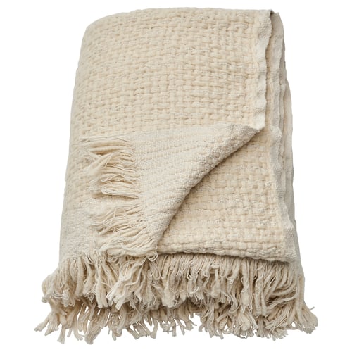 Off-white handwoven throw with fringes. Half cotton, half wool; warm and cosy.
