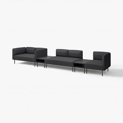 Modern black modular sofa set with three connected pieces, two tables, and sleek metal legs.