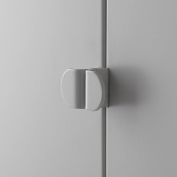 Door with modern, sleek, round handle. Silver finish, smoothly attached to the grey door.