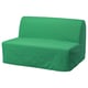 Bright green convertible sofa. Modern design, simple shapes, comfortable cushions.