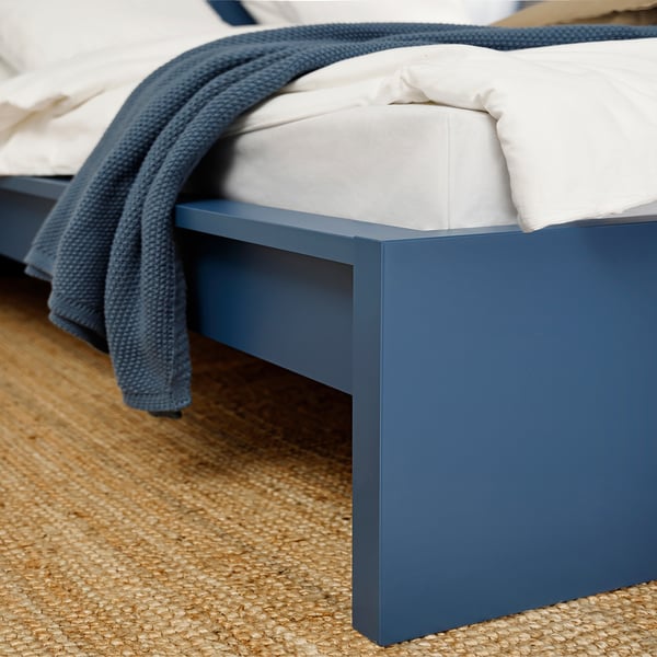 Bed frame with clean lines in blue, showcasing quality construction and elegant design.