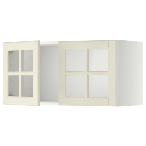 Two off-white METOD kitchen wall cabinets with glass doors and bevelled edges.