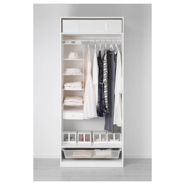 A white, open wardrobe with clothes on hangers, folded clothes, and storage drawers. The design includes shelves and clear organisers.