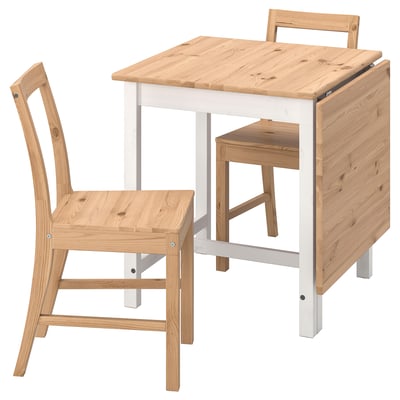 Wooden drop-leaf table with 2 matching chairs, one folded beneath.