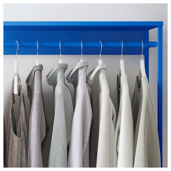 A blue PLATSA clothes rack with hanging garments.