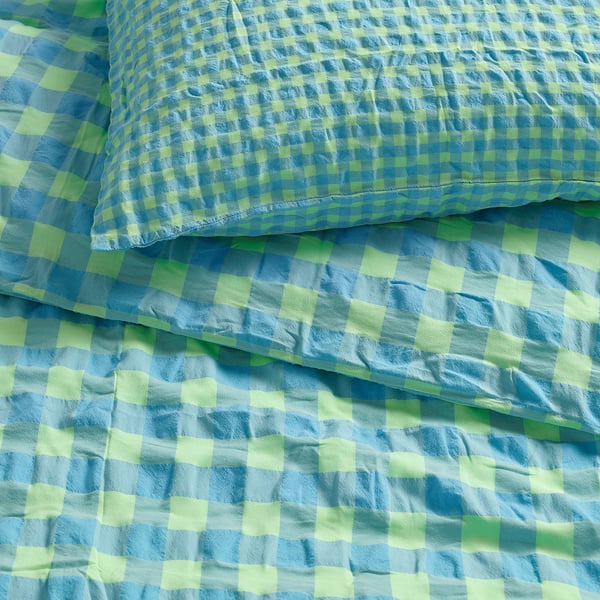 Chequered blue and green bedsheet, soft, textured, quality cotton-rayon blend.