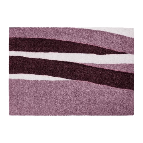 Stylish door mat with wavy red, pink, white stripes. Soft, durable, eco-friendly polyester, effectively traps dirt.