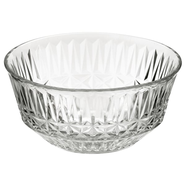 The SÄLLSKAPLIG bowl, clear glass, elegantly patterned. Round shape with intricate diamond-like cuts. Elegant serving bowl for festive occasions.