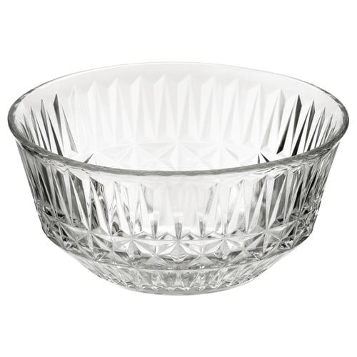 The SÄLLSKAPLIG bowl, clear glass, elegantly patterned. Round shape with intricate diamond-like cuts. Elegant serving bowl for festive occasions.
