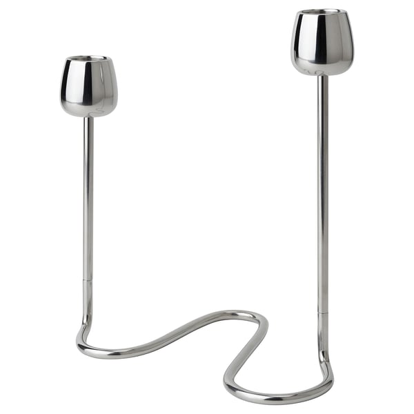 The SILVERPÄRON set includes two stainless steel candlesticks with curved, stem-like bases and rounded cups, reflecting natural flower designs.