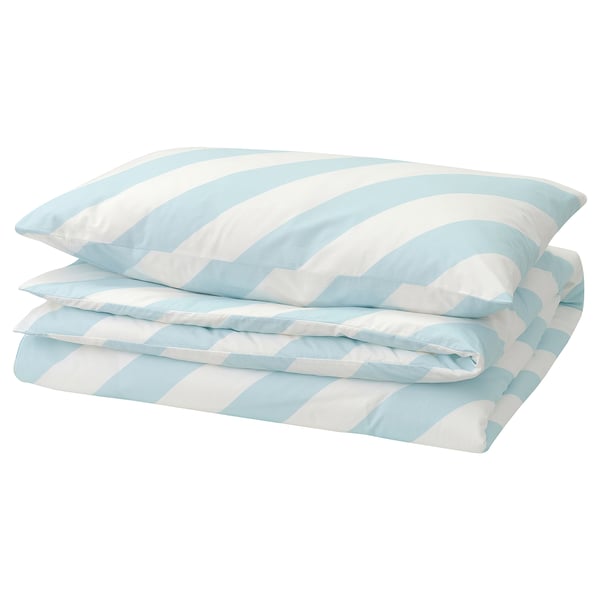 A light blue and white striped bedding set neatly folded; a classic chequered pattern.