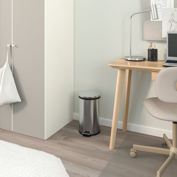Stainless steel SNÖRPA bin in modern home office.