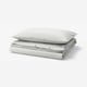 Image shows SOLFIBBLA duvet cover set featuring grey and white stripes on folded rectangle pillows. Made of 100% cotton.