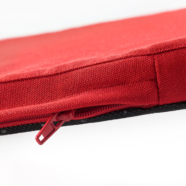 Red chair cushion with smooth, durable fabric and sturdy zip.