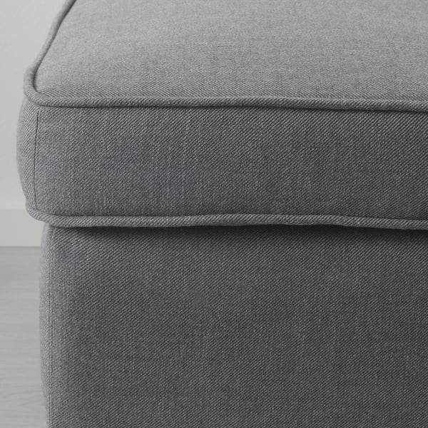 Close-up of plush, grey fabric seat, showcasing high-quality design and stitching.