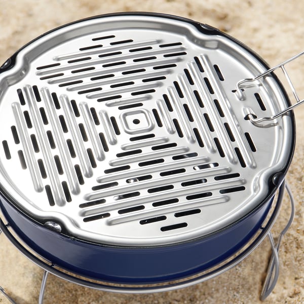 Portable grill with sleek design, stainless steel grates for even heat distribution, foldable handle for easy transport.