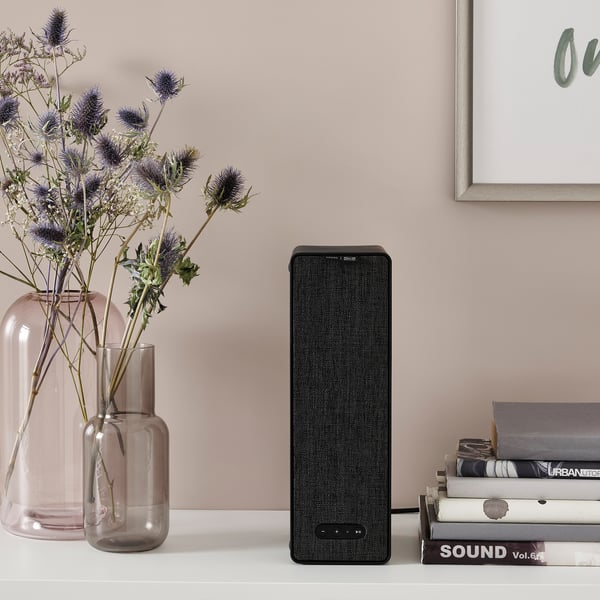 Film & vases on shelf. Speaker streams music, places horizontally or vertically.
