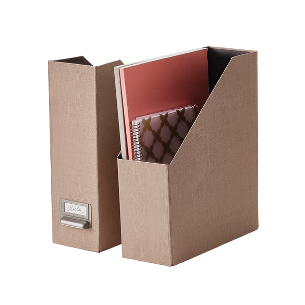 TJOG magazine file, beige, recycled paperboard, upright rectangular shape, metallic handle. Holds papers neatly.
