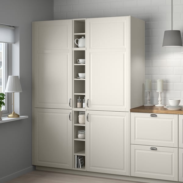 White TORNVIKEN kitchen cabinet displays items, fits narrow spaces.