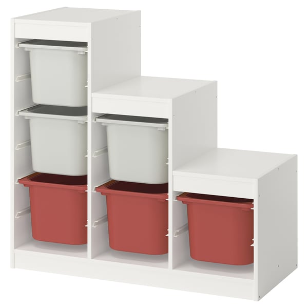 The white ikea TROFAST storage unit with red and white plastic bins. It has three shelves with a staggered design.