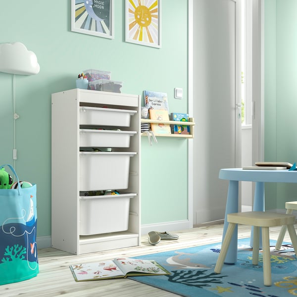 TROFAST white storage unit in kids room, with multiple shelves and toys.