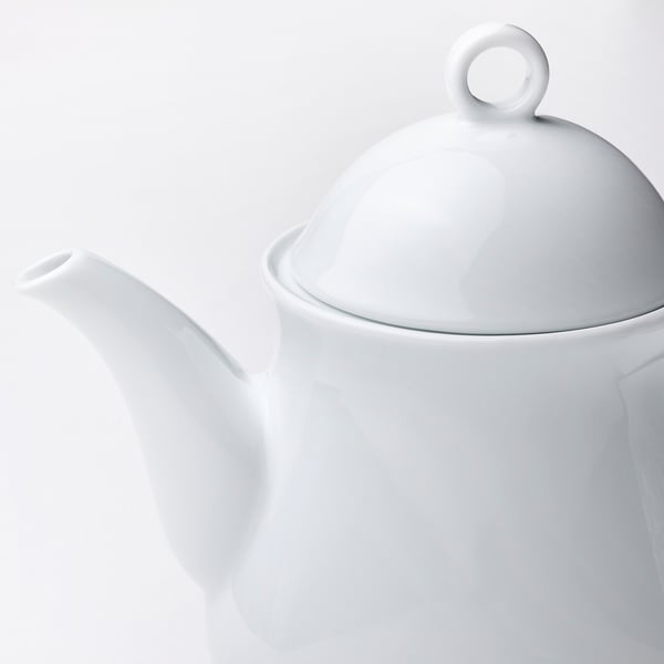 Sleek white porcelain teapot with spout and lid. High-quality finish, durable and elegant.