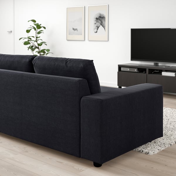 VIMLE black sofa in minimalist living room with tv and plant, cotton-polyester fabric.