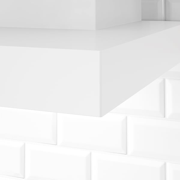 Clean, minimalist white room with smooth, bright surfaces.