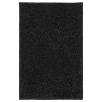 BACKMÅRA black bath mat; rectangular, soft recycled polyester, latex backing for grip, coordinates with bathroom textiles.