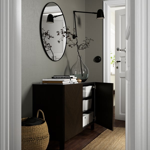 Modern hallway with BESTÅ sideboard, mirror, and wall lamps.