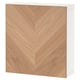 A white BESTÅ storage unit with a light wooden door featuring a herringbone pattern.