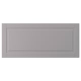 A grey, rectangular BODBYN cabinet door with bevelled panels, made of fibreboard.
