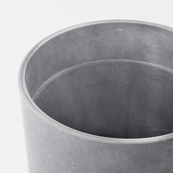 Cylindrical concrete planter with smooth, even texture and natural variations.