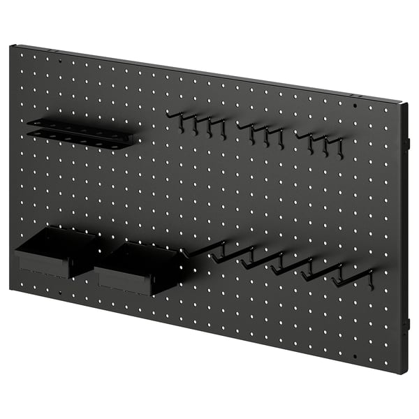 BROR pegboard with black hooks and baskets for garage storage.