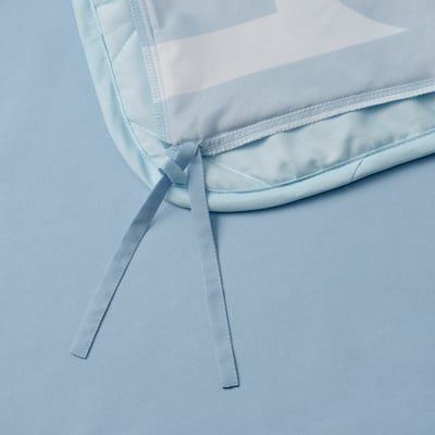 Light blue duvet with adjustable ribbon ties, perfect for warm snuggling.