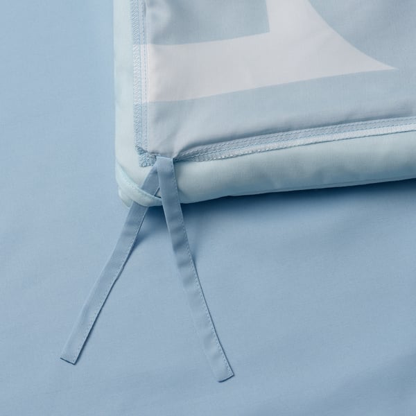 Close-up of soft duvet with ties, machine-washable, good for allergy sufferers.